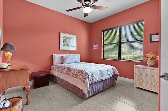 bedroom with light tile patterned floors and ceiling fan