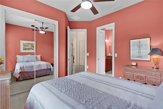 bedroom with a closet, tile patterned floors, and ceiling fan