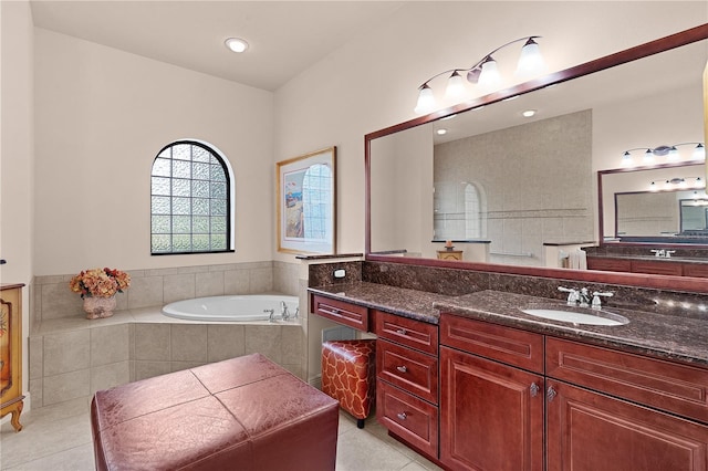 full bathroom featuring a bath, tile patterned flooring, vanity, and recessed lighting