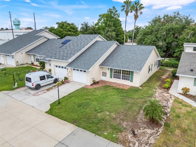 1467 Disston Ave, Clermont, FL 34711 - view of front of house with a shingled roof, a garage, driveway, and a front yard