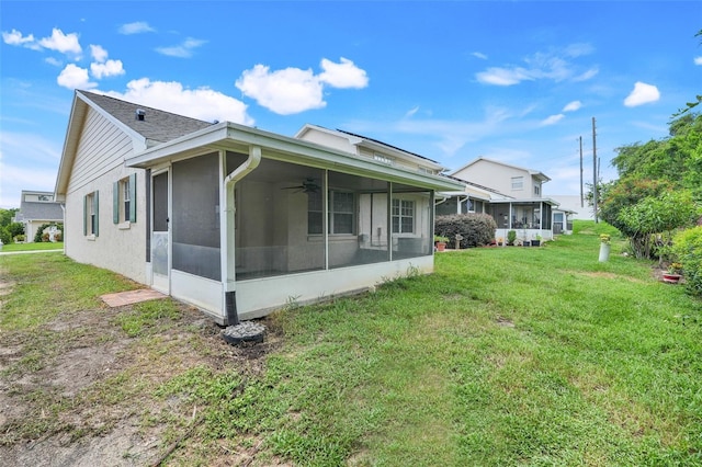 1467 Disston Ave, Clermont, FL 34711 - back of house with a sunroom, a lawn, and a ceiling fan