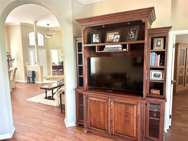 12183 SE 178th St, Summerfield, FL 34491 - living area featuring arched walkways, crown molding, and wood finished floors