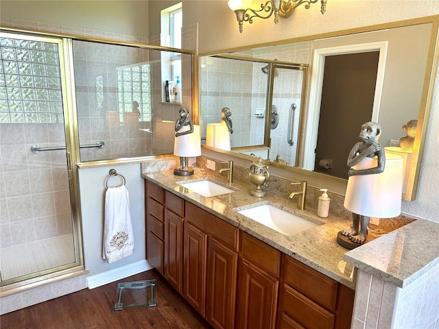 12183 SE 178th St, Summerfield, FL 34491 - bathroom featuring a stall shower, double vanity, and wood finished floors