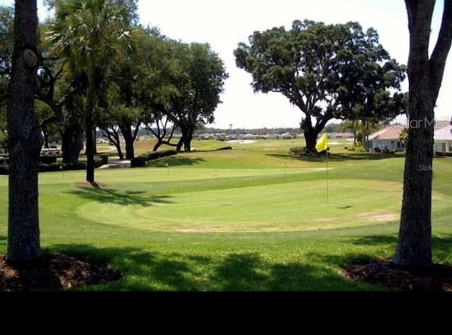 12183 SE 178th St, Summerfield, FL 34491 - view of community with view of golf course, a yard, and a putting area