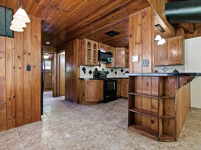 6731 Lake Griffin Rd, Lady Lake, FL 32159 - kitchen featuring black appliances, brown cabinetry, decorative backsplash, wooden walls, and wood ceiling