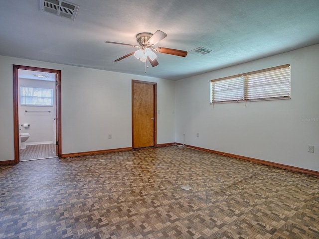 6731 Lake Griffin Rd, Lady Lake, FL 32159 - spare room with baseboards and a ceiling fan