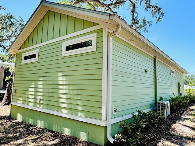 3607 Umbrella Tree Ln, Oxford, FL 34484 - view of side of property with board and batten siding