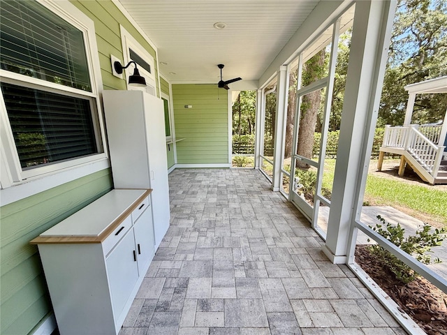 3607 Umbrella Tree Ln, Oxford, FL 34484 - unfurnished sunroom with a ceiling fan