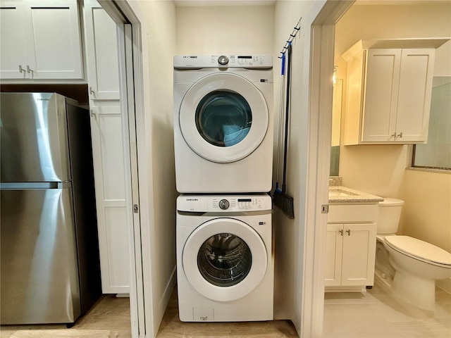 3607 Umbrella Tree Ln, Oxford, FL 34484 - washroom with estacked washer and dryer