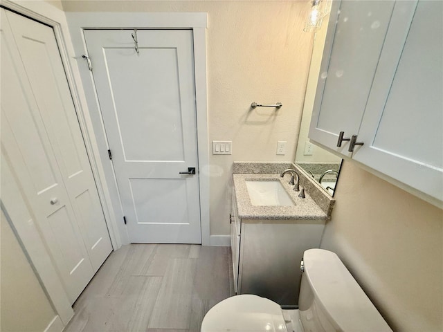 3607 Umbrella Tree Ln, Oxford, FL 34484 - half bath featuring vanity and wood finished floors