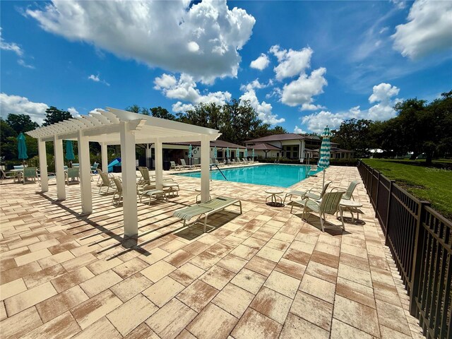 3607 Umbrella Tree Ln, Oxford, FL 34484 - community pool featuring a pergola and a patio