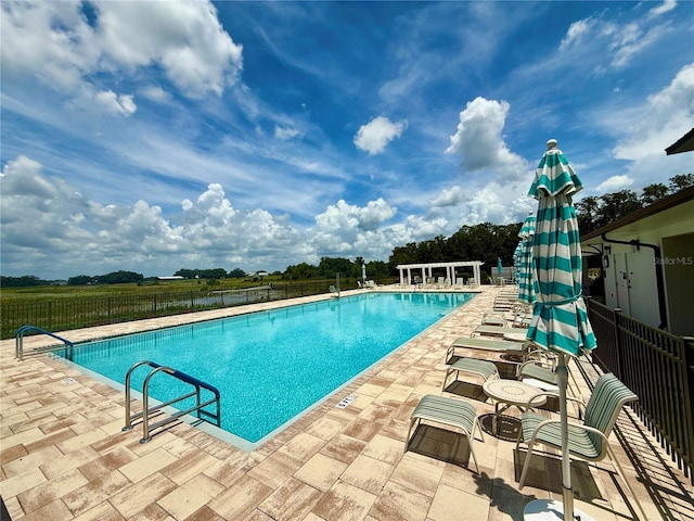 3607 Umbrella Tree Ln, Oxford, FL 34484 - community pool featuring a patio area
