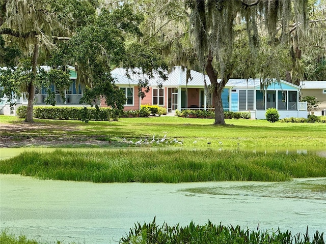 3607 Umbrella Tree Ln, Oxford, FL 34484 - view of home's community with a water view and a yard