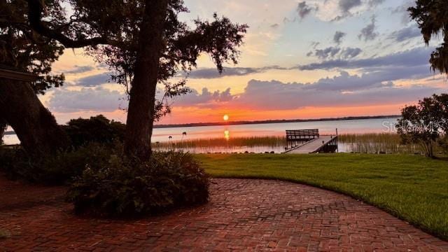 504 Banning Beach Rd, Tavares, FL 32778 - dock area with a water view and a yard