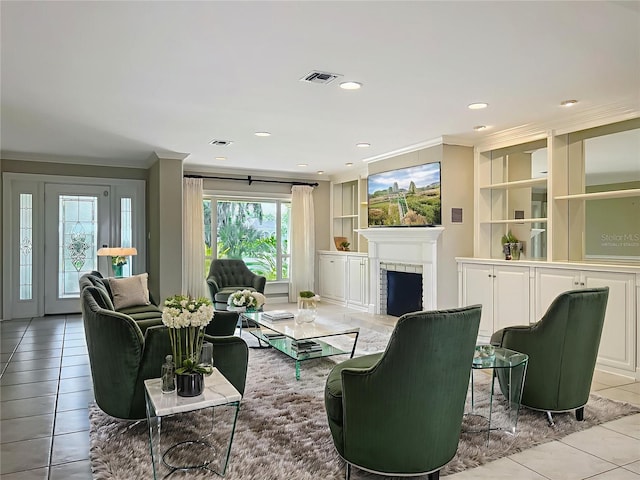 504 Banning Beach Rd, Tavares, FL 32778 - living room with ornamental molding, built in features, light tile patterned floors, a fireplace, and recessed lighting