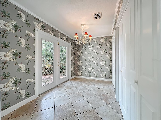 504 Banning Beach Rd, Tavares, FL 32778 - unfurnished dining area featuring a chandelier, wallpapered walls, crown molding, light tile patterned floors, and french doors