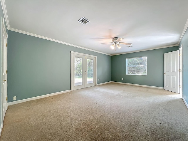 504 Banning Beach Rd, Tavares, FL 32778 - unfurnished room with crown molding, a ceiling fan, plenty of natural light, light colored carpet, and french doors