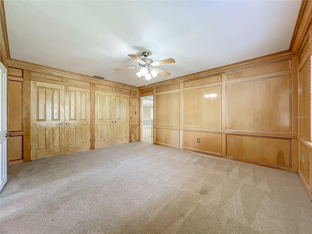 504 Banning Beach Rd, Tavares, FL 32778 - unfurnished bedroom with a decorative wall, light carpet, and ceiling fan