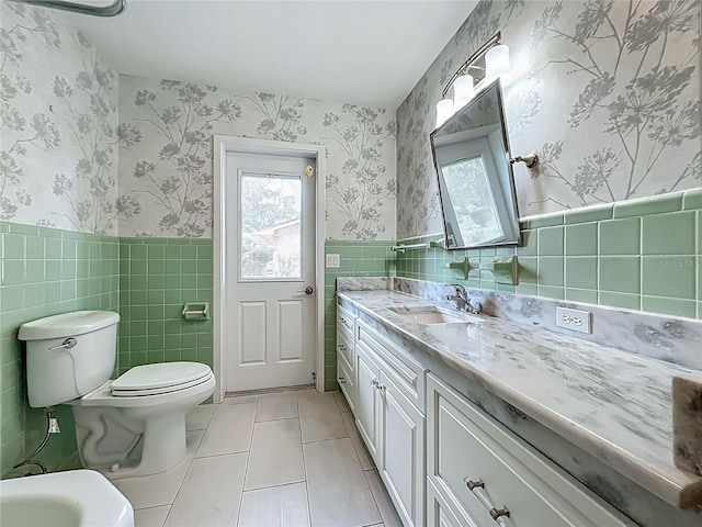 504 Banning Beach Rd, Tavares, FL 32778 - bathroom with tile walls, vanity, tile patterned flooring, a wainscoted wall, and wallpapered walls