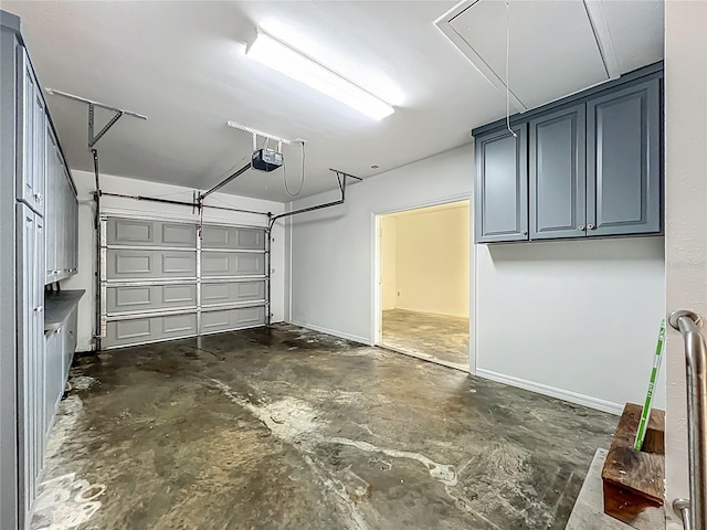 504 Banning Beach Rd, Tavares, FL 32778 - garage featuring a garage door opener and baseboards