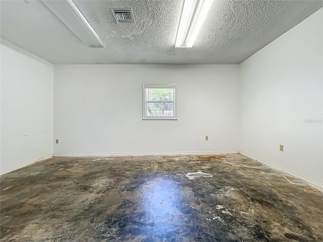 504 Banning Beach Rd, Tavares, FL 32778 - empty room with a textured ceiling and baseboards