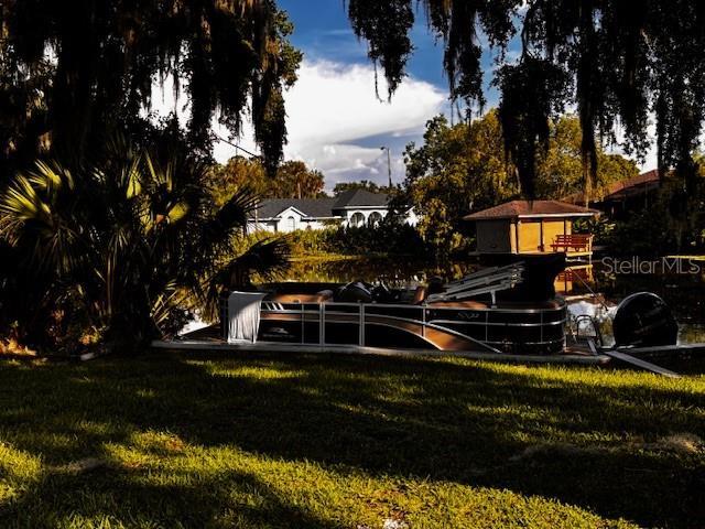 504 Banning Beach Rd, Tavares, FL 32778 - view of grassy yard with a dock