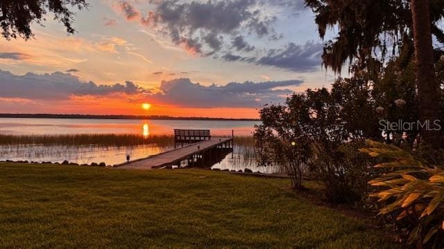 504 Banning Beach Rd, Tavares, FL 32778 - dock with a water view and a yard