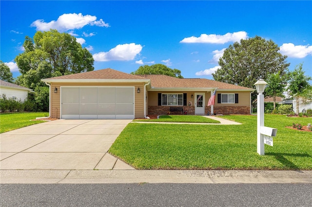9790 SE 175th St, Summerfield, FL 34491 - ranch-style home featuring an attached garage, driveway, and a front lawn