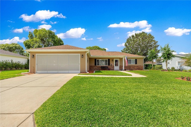9790 SE 175th St, Summerfield, FL 34491 - ranch-style home featuring a garage, concrete driveway, and a front yard