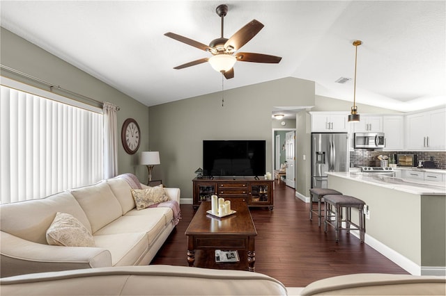 9790 SE 175th St, Summerfield, FL 34491 - living room with vaulted ceiling, ceiling fan, and dark wood finished floors