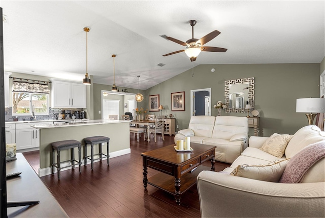 9790 SE 175th St, Summerfield, FL 34491 - living area with dark wood-style flooring, ceiling fan, and vaulted ceiling