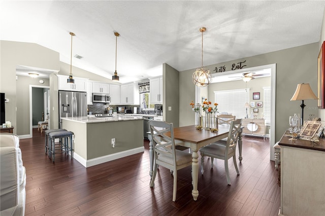 9790 SE 175th St, Summerfield, FL 34491 - dining space with lofted ceiling, ceiling fan, and dark wood-style flooring