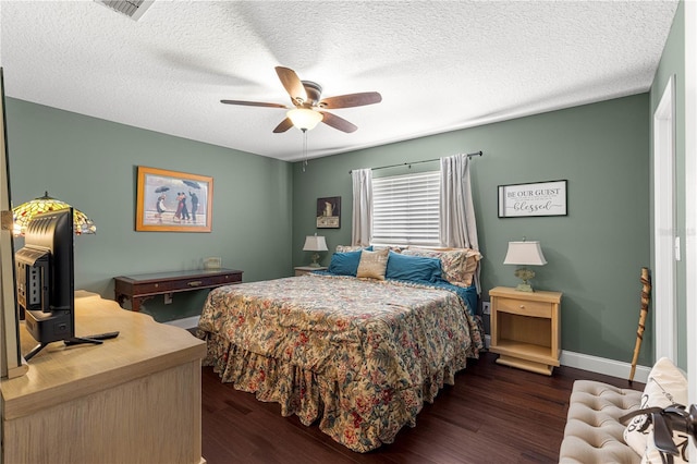9790 SE 175th St, Summerfield, FL 34491 - bedroom with dark wood finished floors, a ceiling fan, and a textured ceiling