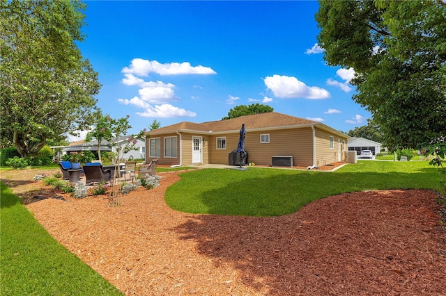 9790 SE 175th St, Summerfield, FL 34491 - back of property with a patio and a yard