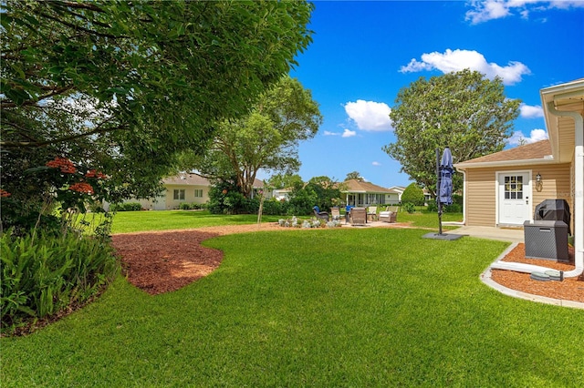 9790 SE 175th St, Summerfield, FL 34491 - view of green lawn featuring a patio area and an outdoor hangout area