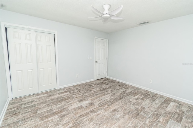 25 Jule Rd, Macclenny, FL 32063 - unfurnished bedroom with light wood finished floors, a closet, and a ceiling fan