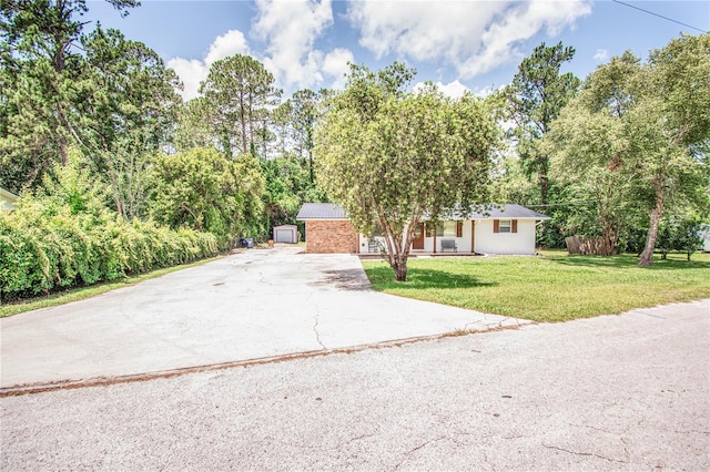 25 Jule Rd, Macclenny, FL 32063 - view of front of home featuring concrete driveway and a front lawn