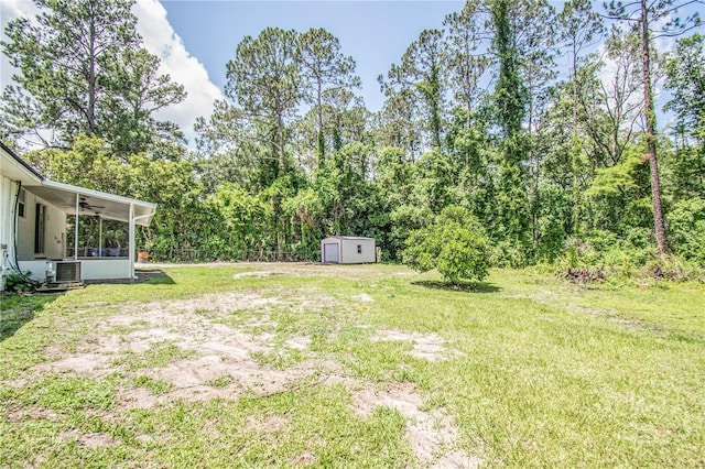25 Jule Rd, Macclenny, FL 32063 - view of grassy yard featuring a storage unit, a ceiling fan, and a sunroom