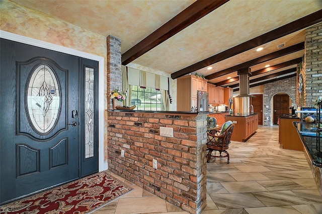 13033 SE 158th Ln, Weirsdale, FL 32195 - foyer with brick wall, arched walkways, and ornate columns