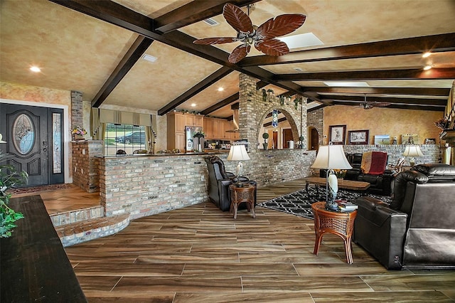 13033 SE 158th Ln, Weirsdale, FL 32195 - living area with ceiling fan, brick wall, and wood finish floors