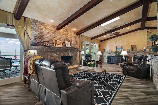 13033 SE 158th Ln, Weirsdale, FL 32195 - living room featuring a fireplace, wood finished floors, brick wall, and a ceiling fan