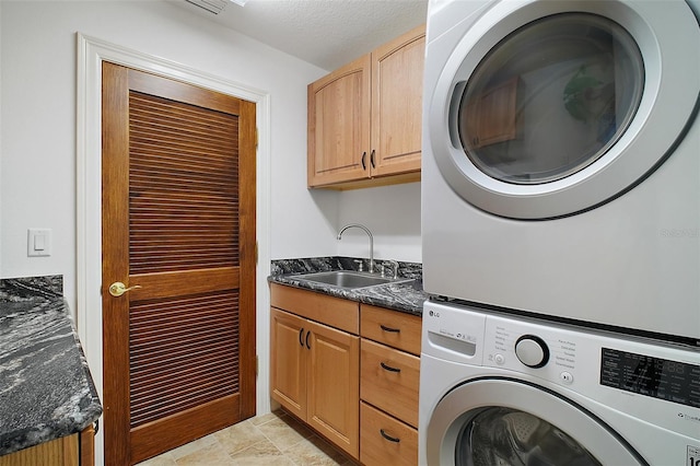 13033 SE 158th Ln, Weirsdale, FL 32195 - laundry area featuring estacked washer and dryer and cabinet space