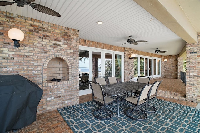 13033 SE 158th Ln, Weirsdale, FL 32195 - view of patio featuring a ceiling fan, a grill, french doors, and outdoor dining space