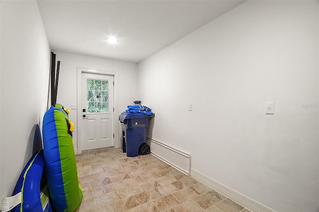 13033 SE 158th Ln, Weirsdale, FL 32195 - laundry room with stone finish flooring and baseboards