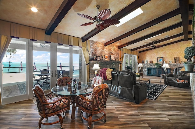 13033 SE 158th Ln, Weirsdale, FL 32195 - dining room featuring ceiling fan, wood finished floors, and a brick fireplace