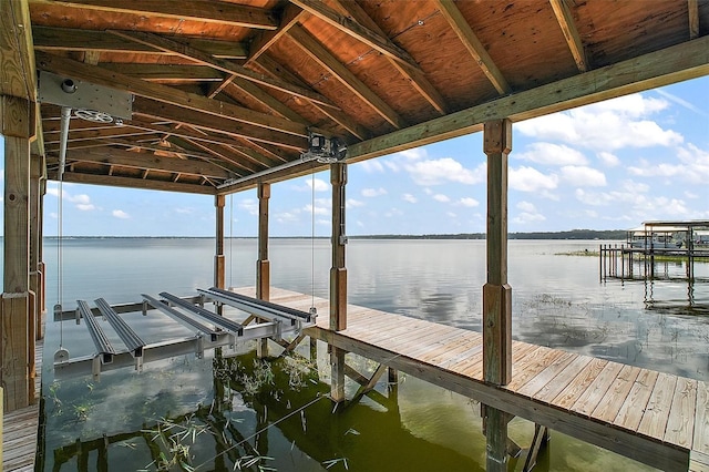 13033 SE 158th Ln, Weirsdale, FL 32195 - dock featuring boat lift and a water view