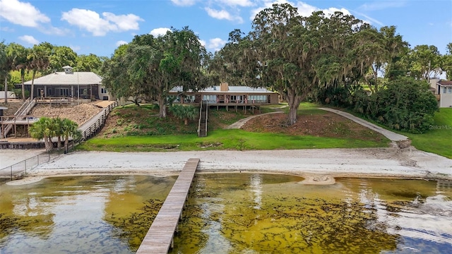 13033 SE 158th Ln, Weirsdale, FL 32195 - dock with a water view and a lawn