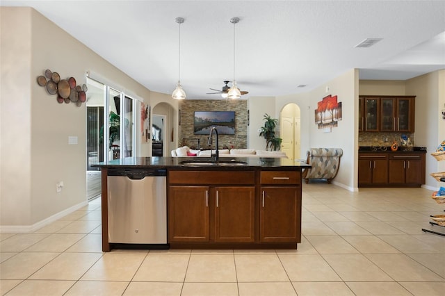 4018 Chandler Estates Dr, Apopka, FL 32712 - kitchen featuring dishwasher, arched walkways, and light tile patterned flooring