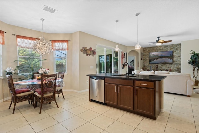 4018 Chandler Estates Dr, Apopka, FL 32712 - kitchen featuring stainless steel dishwasher, a chandelier, arched walkways, open floor plan, and ceiling fan