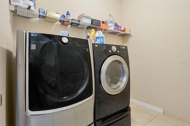 4018 Chandler Estates Dr, Apopka, FL 32712 - washroom featuring washer and dryer and light tile patterned floors